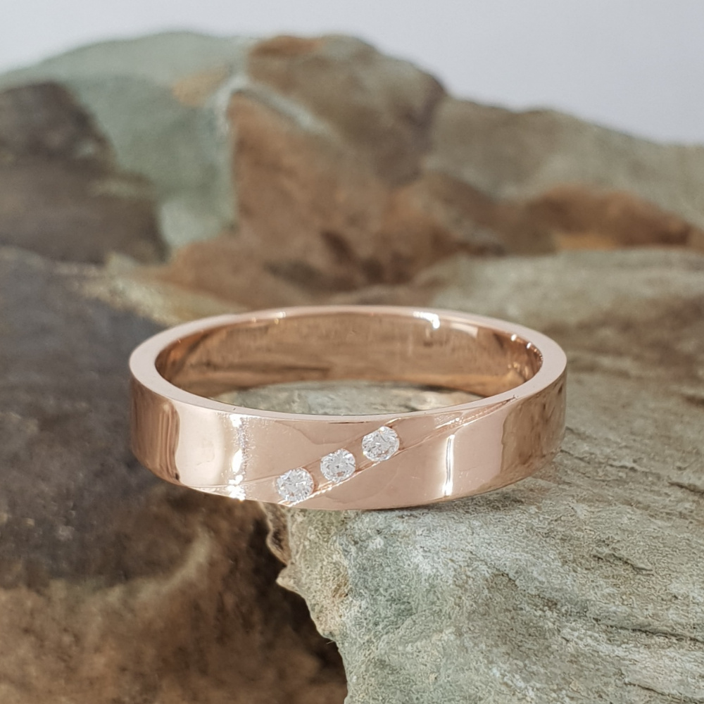 Realistic picture of A Rose Gold Ring Studded With Three Diamonds
